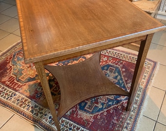 An Edwardian Mahogany Lamp Table.