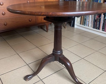 An English 18th Century Mahogany Tea Table with One-Piece Top and Birdcage Action.