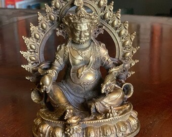 A Small Tibetan Gilt Metal Bronze of Kubera
