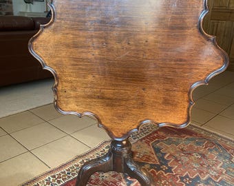 An 18th Century Mahogany Tea Table.
