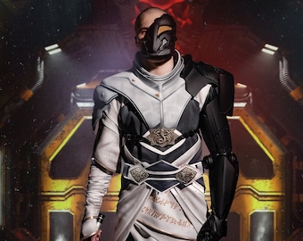 May include: A person wearing a white and black costume with a black mask, holding a glowing orange lightsaber. The person is standing in a dark, industrial setting with yellow and orange accents.