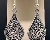 Sterling silver, designer dangle earrings. 18x34mm drop on hook. Nice weight balance.