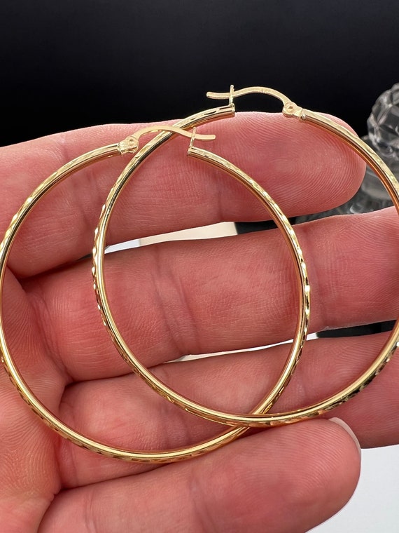 Classy 14k hammered texture hoop earrings. 50mm