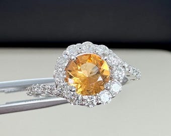 Imperial Topaz in 14k with natural diamonds.