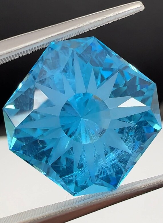 23.5ct Precision cut Electric Blue Topaz.