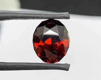 Unheated red Zircon. 6.95ct Mozambique oval. Precision cut.