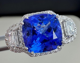 Tanzanite in elegant natural diamond custom mounting.