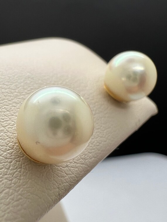 8mm pearl earrings in 14k yellow gold.