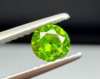 Russian Demantoid Garnet. Horsetail inclusions. 4mm Old European cut