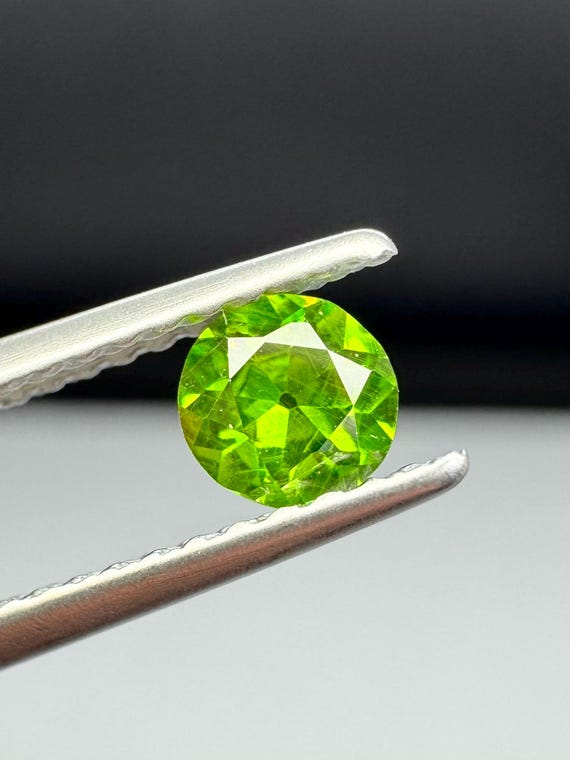 Russian Demantoid Garnet. Horsetail inclusions. 4mm Old European cut
