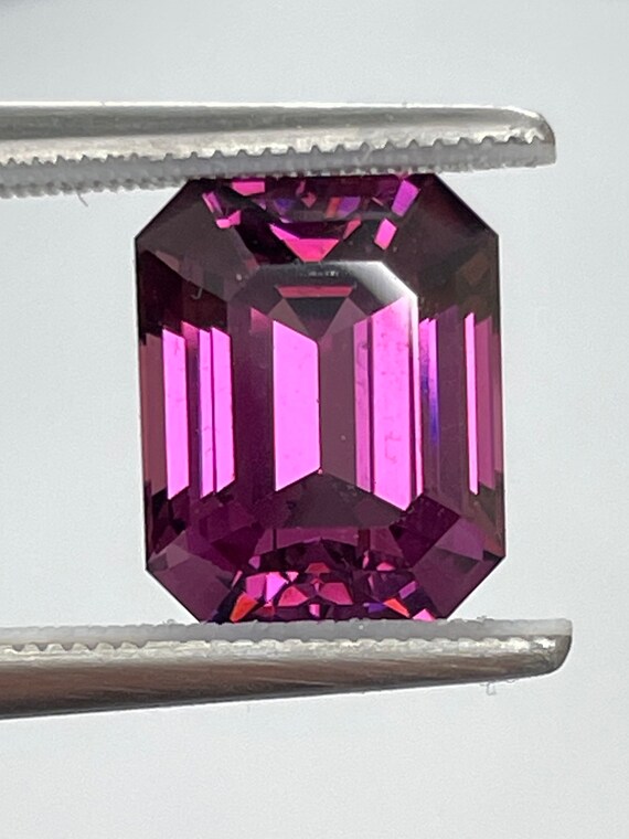 3.9ct Purple Garnet. Mozambique origin. Untreated 9.34x7.61mm nice emerald cut.