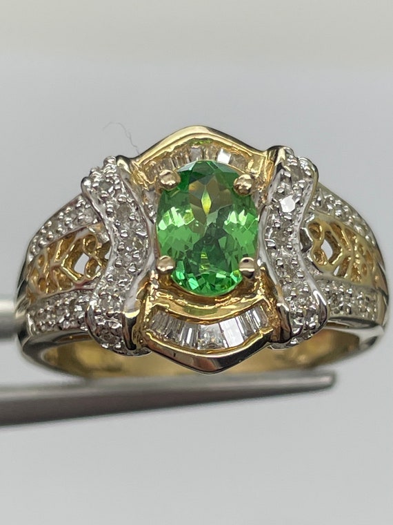 Tsavorite Garnet in 14k solid gold. Size 7, natural gold accents.