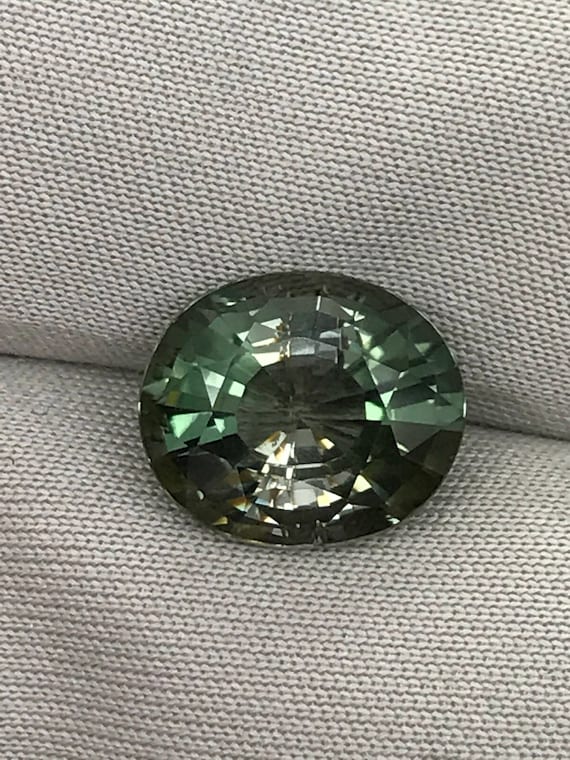 Three carat bi color Tourmaline oval.