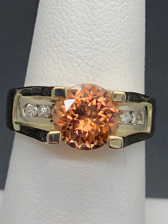 Precision cut apricot Natural Zircon in European style shank w/ Diamond. 14k