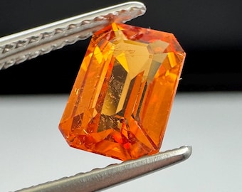 Mandarin Garnet 2.2ct emerald cut.