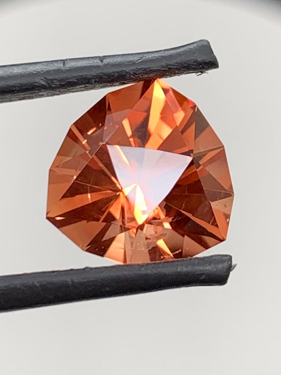 Oregon Sunstone trillion. 4.81ct natural, Precision cut gem. Light Schiller. Red, Orange. Nicely cut.