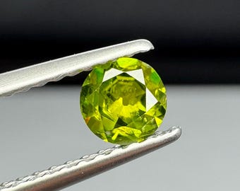 Russian Demantoid Garnet. Horsetail inclusions. 4.28mm Old European cut