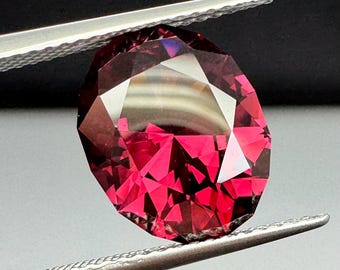 Oval 5.69ct Rhodolite Garnet. Precision cut.