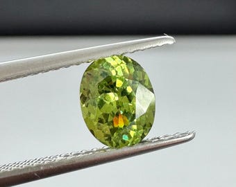 Russian Demantoid Garnet oval. 1.2ct