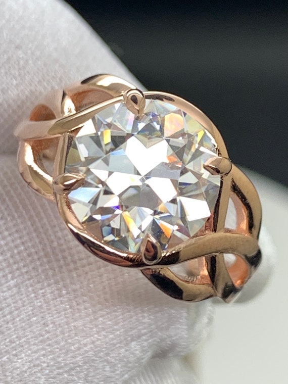 Custom made 10mm (4ct) moissanite and rose gold ring. 14k designer setting. Great color in a old European cut design.