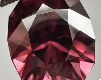 Precision cut Pink Zircon. 4.65ct rich color, unheated oval.