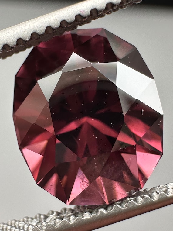 Precision cut Pink Zircon. 4.65ct rich color, unheated oval.