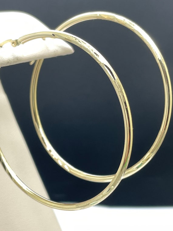 50mm large yellow gold hoops. 14k etched design. New jewelery.