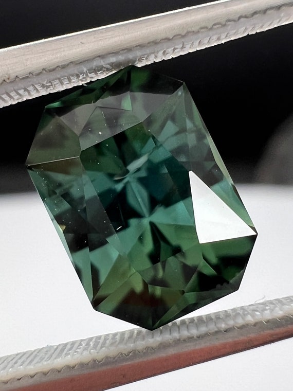 Blue Green, precision cut Tourmaline. 2.52ct Emerald shape. Exquisite polish and color.