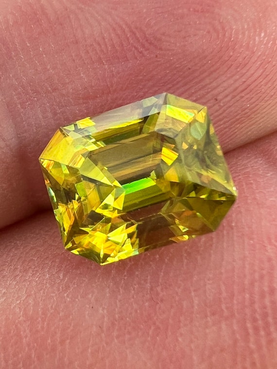 4ct Gem grade Sphene. Emerald cut, clean, untreated, nicely cut.