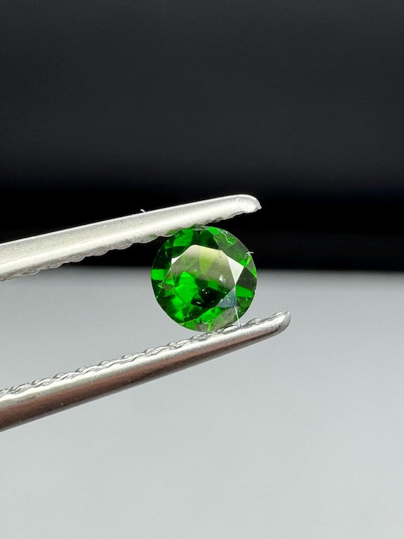 Russian demantoid garnet with horsetail inclusions, old European cut. 3.65mm