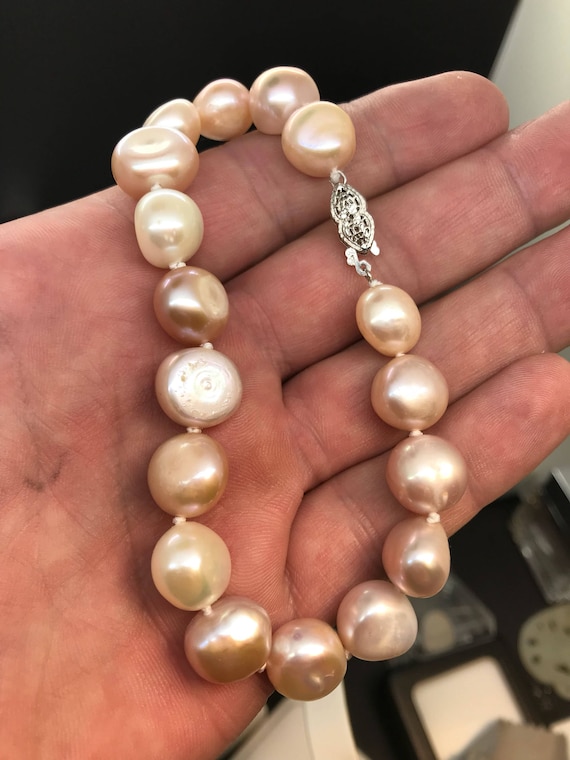 Natural Pearl bracelet, (cultured natural pastel shapes.) 14k clap.