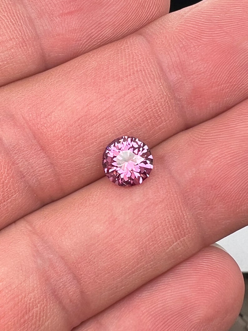 Rare pink, fuchsia color Garnet. Natural, Tanzanian origin gem. Precision cut round. 7.4mm image 2