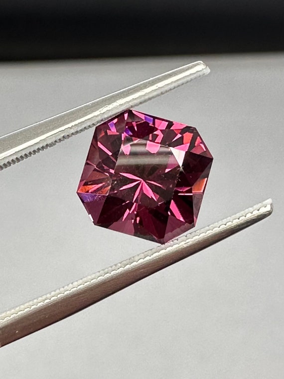 Precision cut 4.09ct Rhodolite Garnet. Great cut and polish. Bright open color.