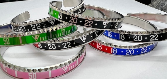 Watch bezel, speedometer style, unidentified unisex bracelet. Pepsi Bezel, coke, Batman, hulk, red, black, stainless steel adjustable.