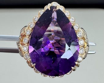 Amethyst in 14k gold ring. Natural diamonds.