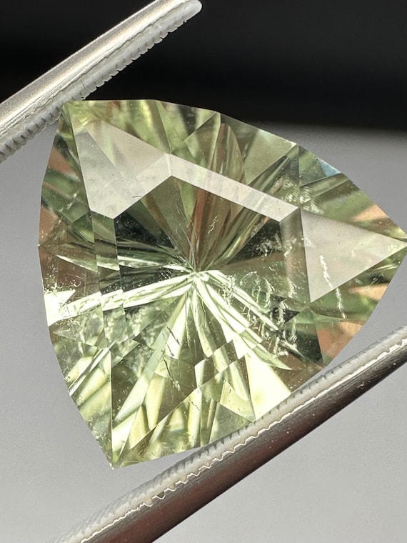 Mint green trillion Tourmaline. 7.1ct concave facet, precision cut gem.