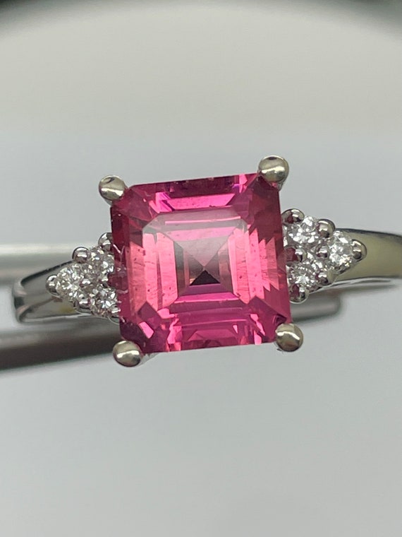 Pink Sapphire, (synthetic) ring with natural diamond accents. 14k white gold, size 7.25.