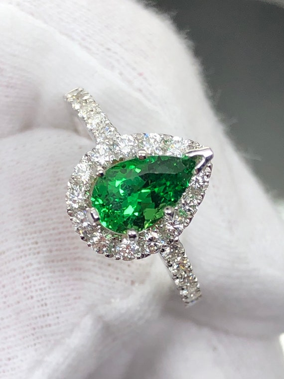 Breathtaking 1.2ct Natural untreated Tsavorite Garnet in 18k white gold and natural diamonds.