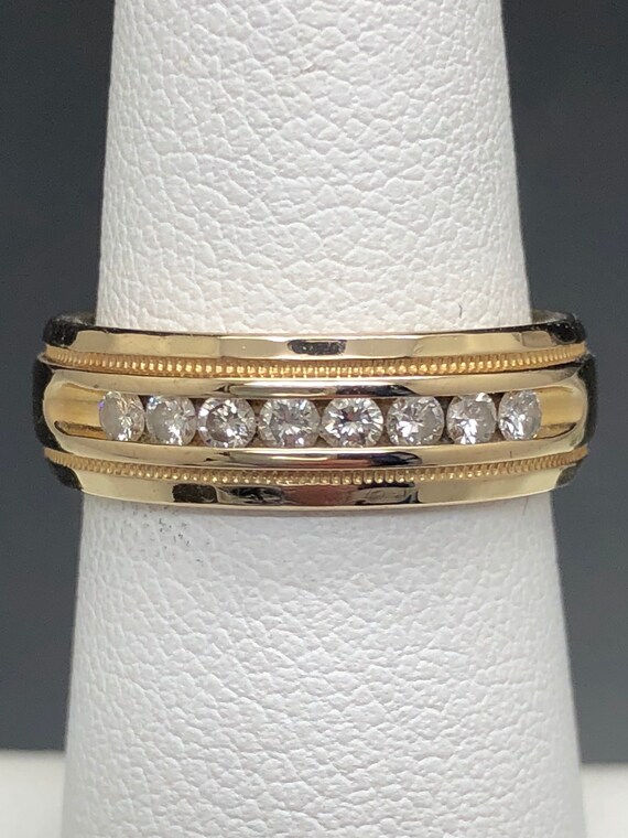 Designer band that I upgraded the diamonds in. Very clean melee pieces that pop. Overa quarter carat of diamond brilliance!