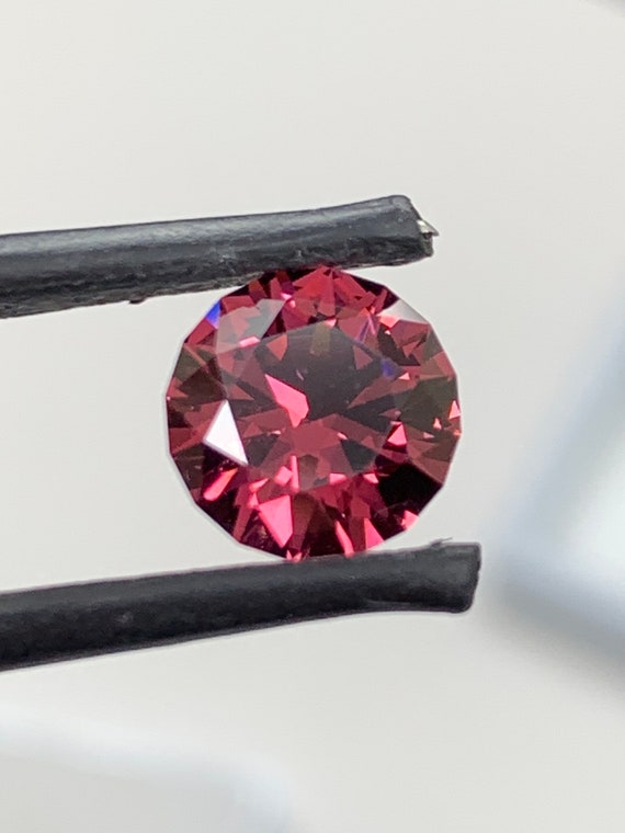 Precision cut round Garnet. Natural 2.3ct Rhodolite gemstone.