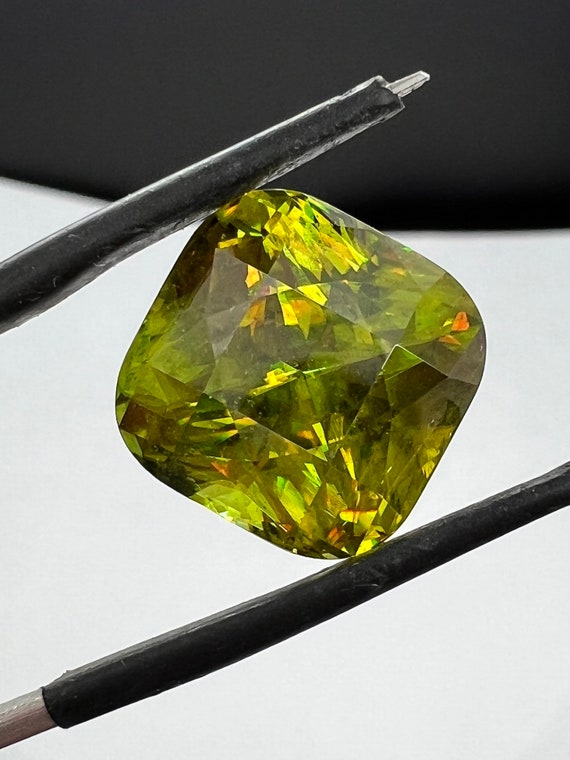 19ct huge collector grade Sphene! Amazing cushion cut, neon green stone. Untreated 15x11mm.