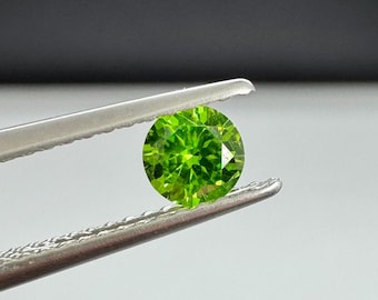 Demantoid Garnet, Russian origin 4.13mm horsetail inclusions.