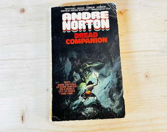May include: Vintage paperback book titled "Dread Companion" by Andre Norton. The cover features a dark, illustrated scene with figures and a monster. The book's title is in red and white lettering, with the author's name above it.
