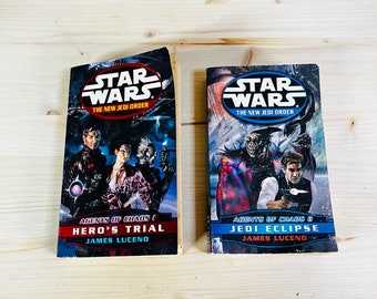 May include: Two Star Wars novels, "Hero's Trial" and "Jedi Eclipse," from the New Jedi Order series. The covers feature character illustrations and the Star Wars logo. The author's name, James Luceno, is also visible.