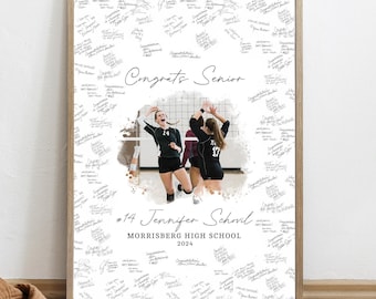 Puede incluir: Una impresión enmarcada con una foto del equipo de voleibol, rodeada de firmas manuscritas. Las palabras "Congrats Senior" están escritas en cursiva. La impresión también incluye el texto "#14 Jennifer Schovil" y "Morrisberg High School 2024".