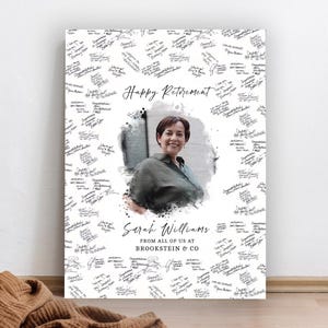 May include: A rectangular retirement sign featuring a central photograph of a person surrounded by numerous handwritten-style messages. The text reads Happy Retirement, Sarah Williams, and FROM ALL OF US AT BROOKSTEIN & CO in black ink.