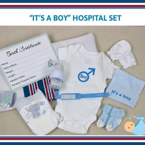 May include: A hospital set for a newborn baby, including a white onesie with a blue "Boy" symbol, a blue and white striped hat, a blue and white blanket, a white diaper, a blue wristband, a white baby hat, a blue baby sock, a white baby mitten, a clear baby bottle, and a birth certificate.