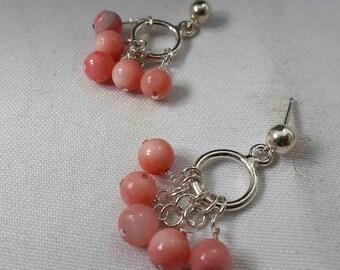 Gorgeous dangle earrings adorned with pink tourmaline gemstone .