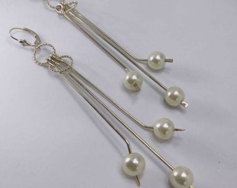 Lovely sterling silver earrings enhanced with freshwater white pearls