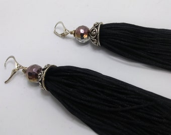 Gorgeous black tassels earrings .